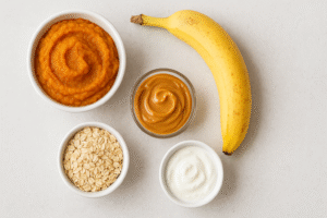 Ingredients for easy pumpkin dog treats: pumpkin, oats, peanut butter, and banana