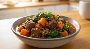 Homemade beef and sweet potato dog food stew with spinach